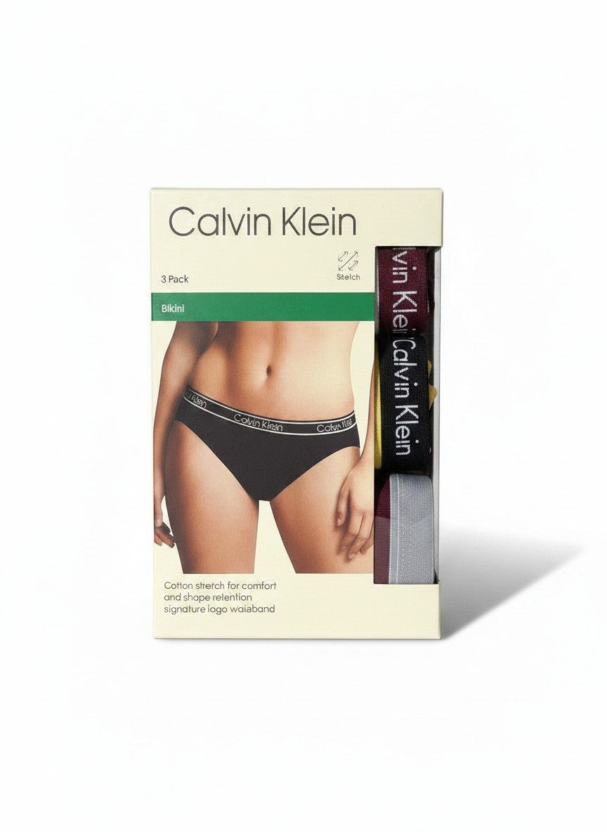 Pack de 3 braguitas bikini Calvin Klein de algodón elástico para mujer, con cinturilla de logo distintiva. Colores: negro, burdeos, gris y amarillo.