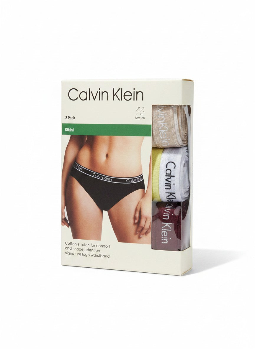 Pack de 3 bragas bikini Calvin Klein de algodón elástico para mujer con cintura con logo. Colores: negro, beige, amarillo y burdeos.