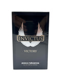 ELIFE BOUTIQUE Invictus Victory Eau de Parfum Extrême para hombre, frasco de 6.8 oz con diseño de alas plateadas sobre fondo negro.