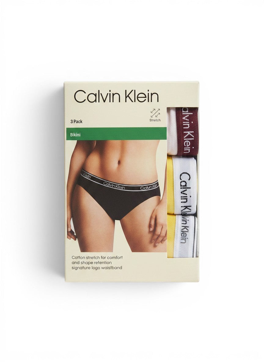 Pack de 3 bragas bikini Calvin Klein de algodón elástico para mujer con cintura con logo. Colores: gris, blanco, burdeos y amarillo.